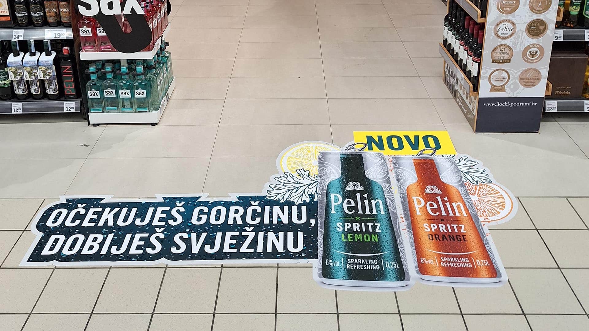 podna grafika ispred polica pića